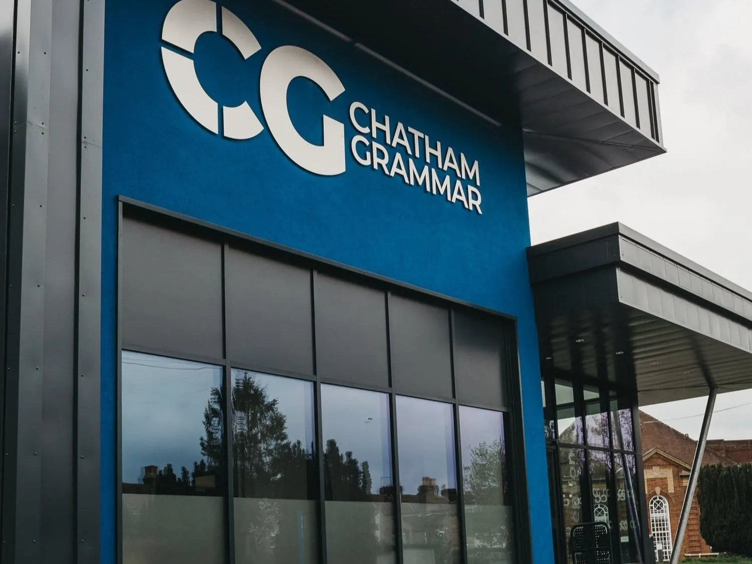 Chatham Grammar School - Modern building exterior with blue signage
